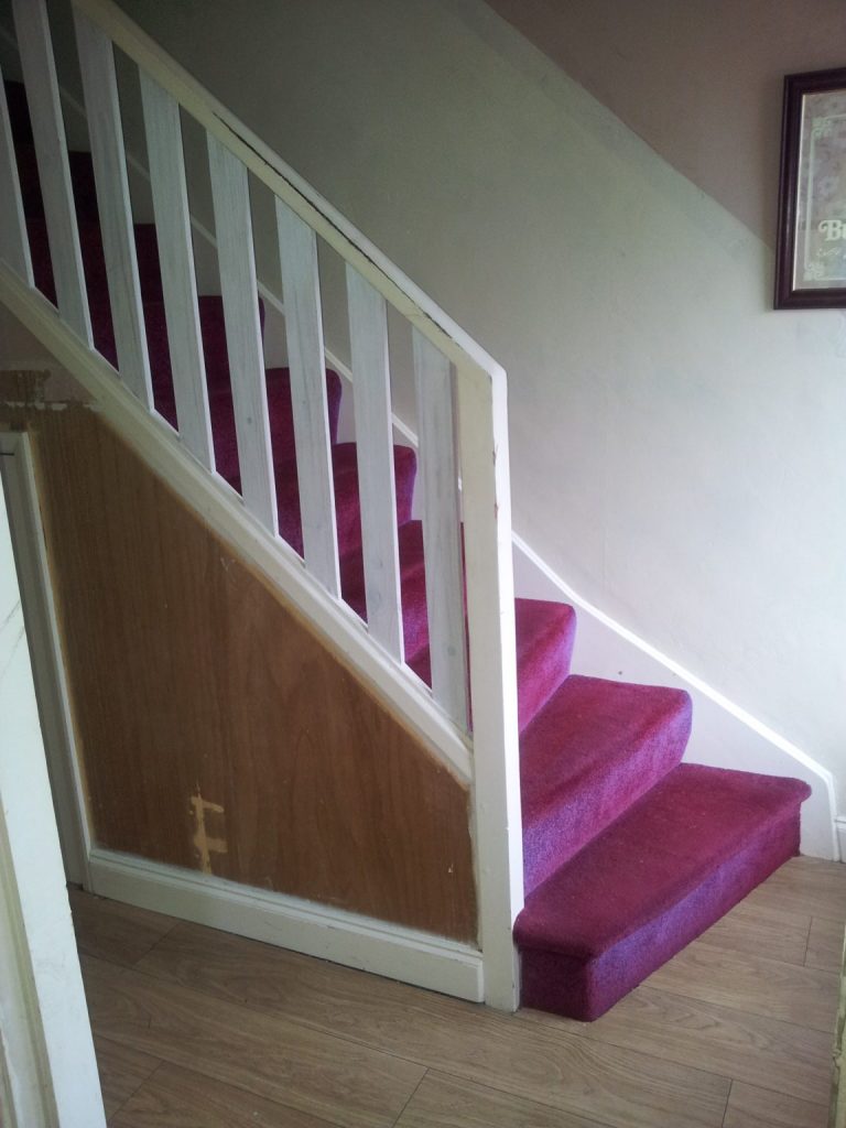 This is our staircase as we inherited it. Click on the picture to see the painted staircase transformation!
