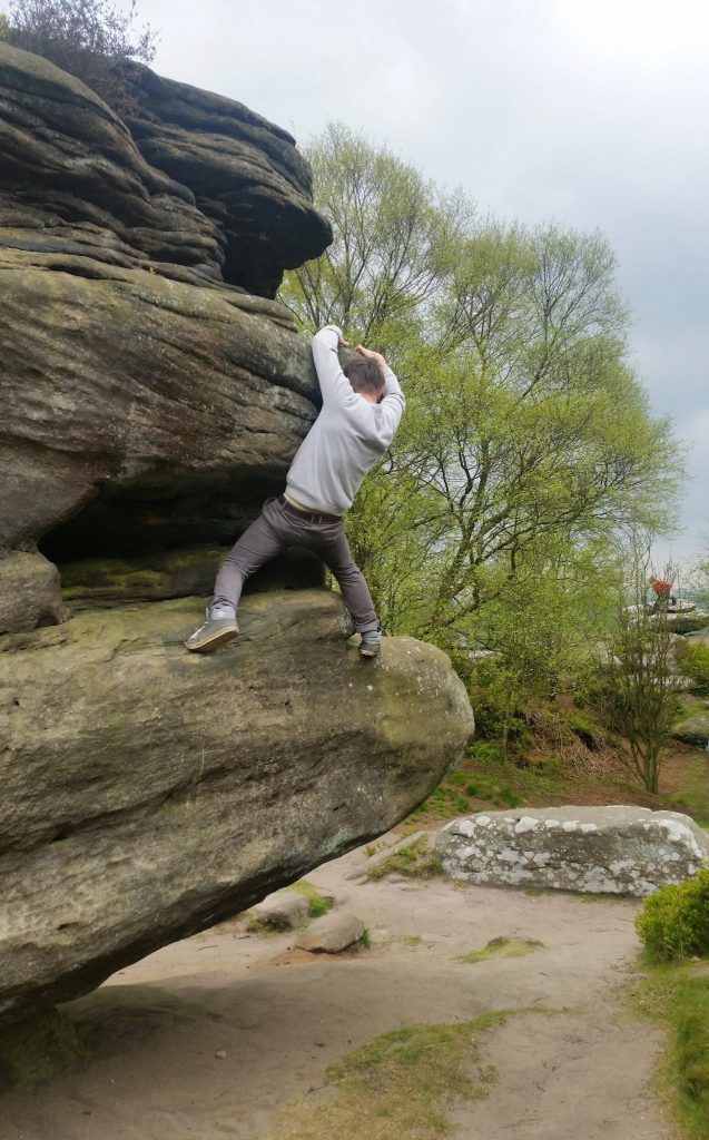 Lord Balders hanging backwards off an impossible rock, as he is often found.