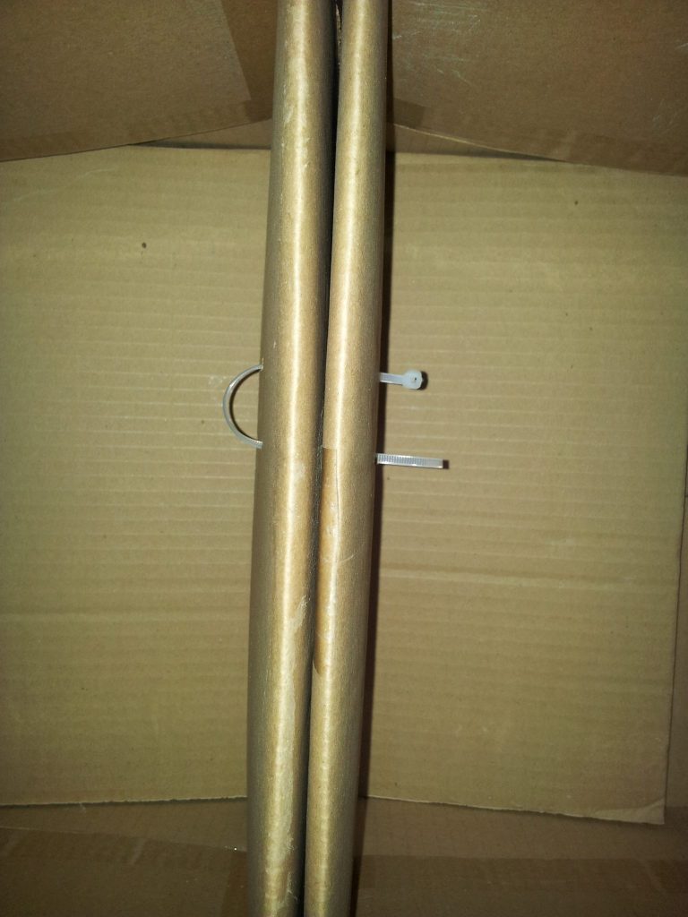 Connecting the cardboard boxes with cable ties.