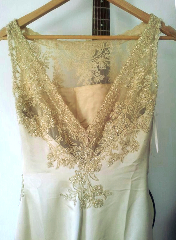 Gold Pronovias sample wedding dress with lace back.