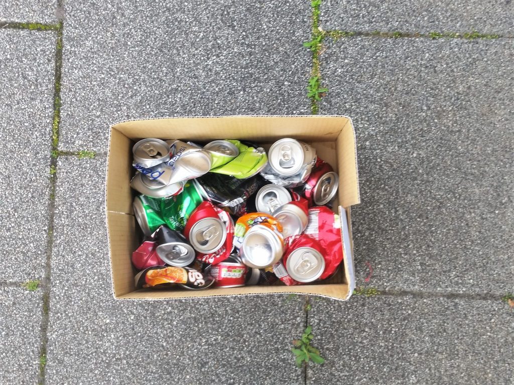 Collecting aluminium cans for melting.